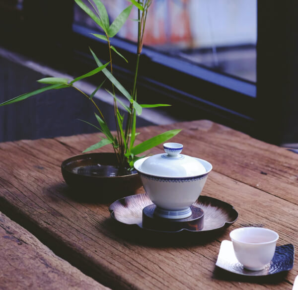 bomboo plant, tea kettle and tea cup
